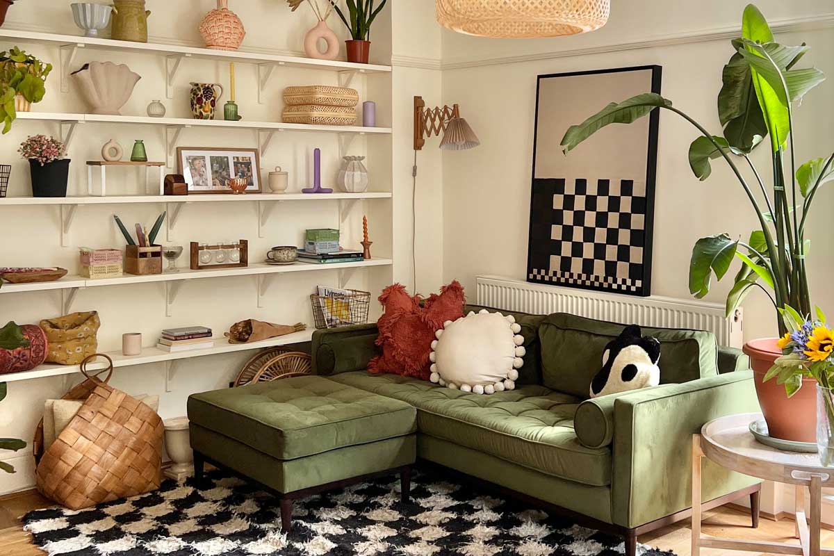 Large checkerboard framed canvas above sofa in bohemian style living space