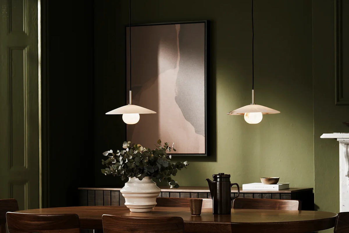 Deep brown large abstract canvas art hanging in a moody green interior to create a cosy feel