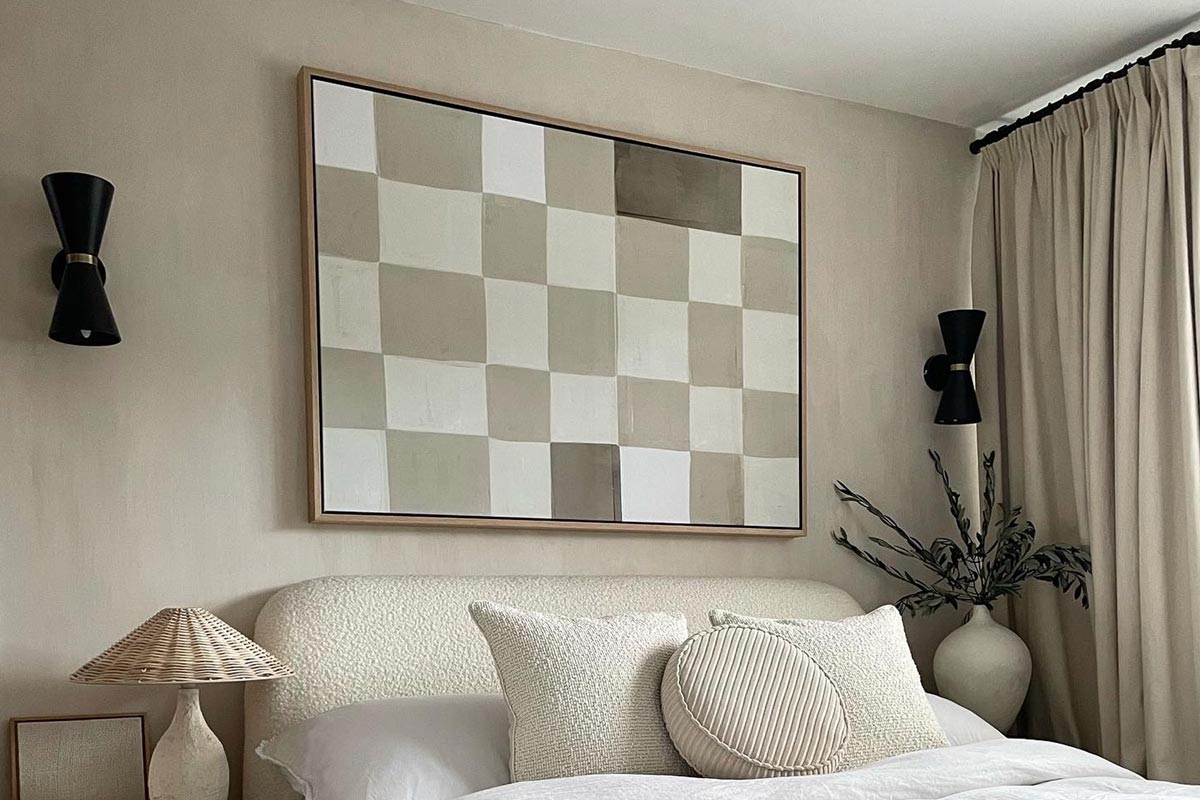 Large checkerboard framed canvas art in neutral bedroom