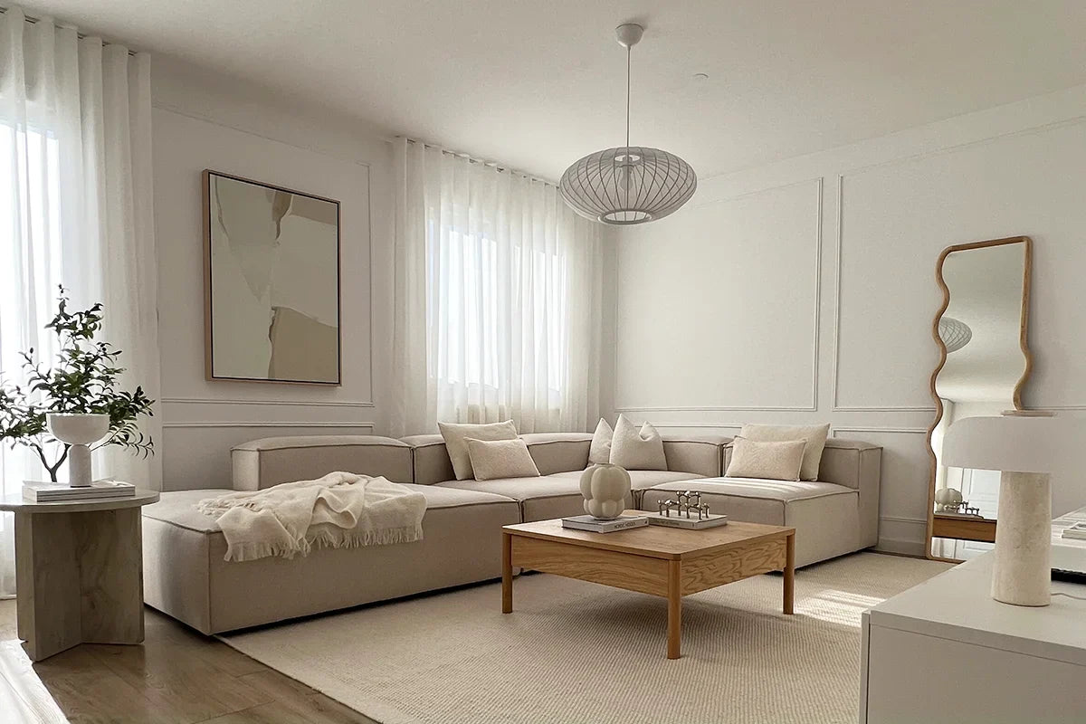 Drift Off, a large neutral abstract canvas art pictured above a console and sofa in an all neutral living room