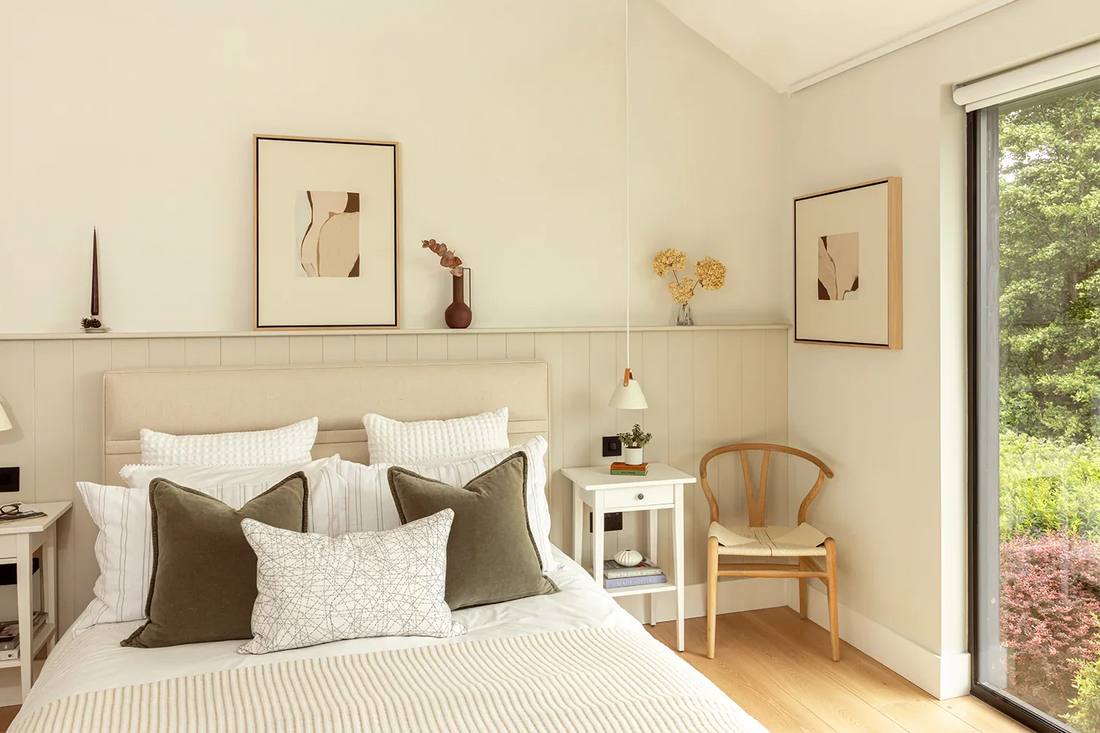 Open Up and Take It In framed canvases in a light, neutral, scandi-style bedroom